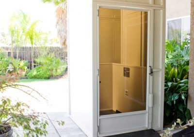 A door that is open and has a glass window.