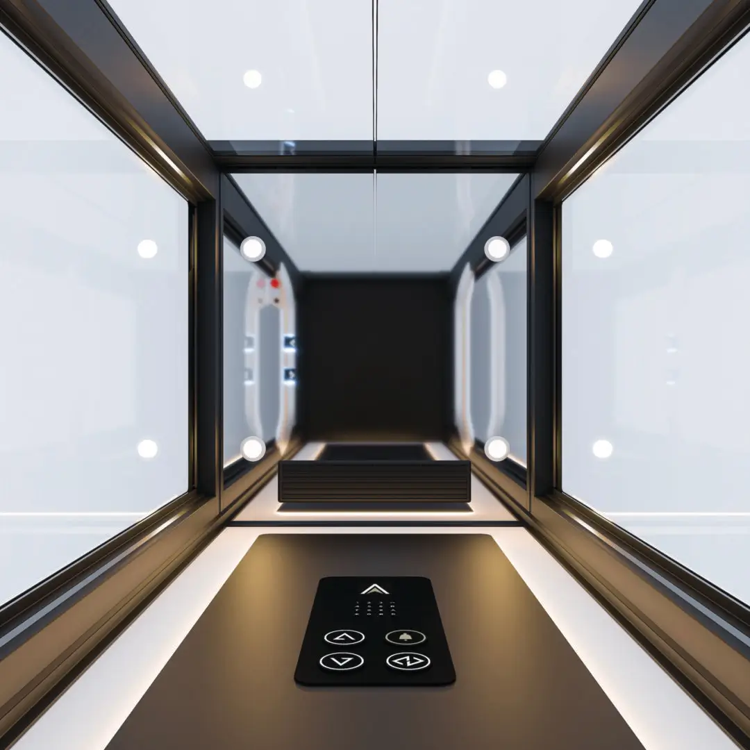 Modern glass elevator interior with control panel
